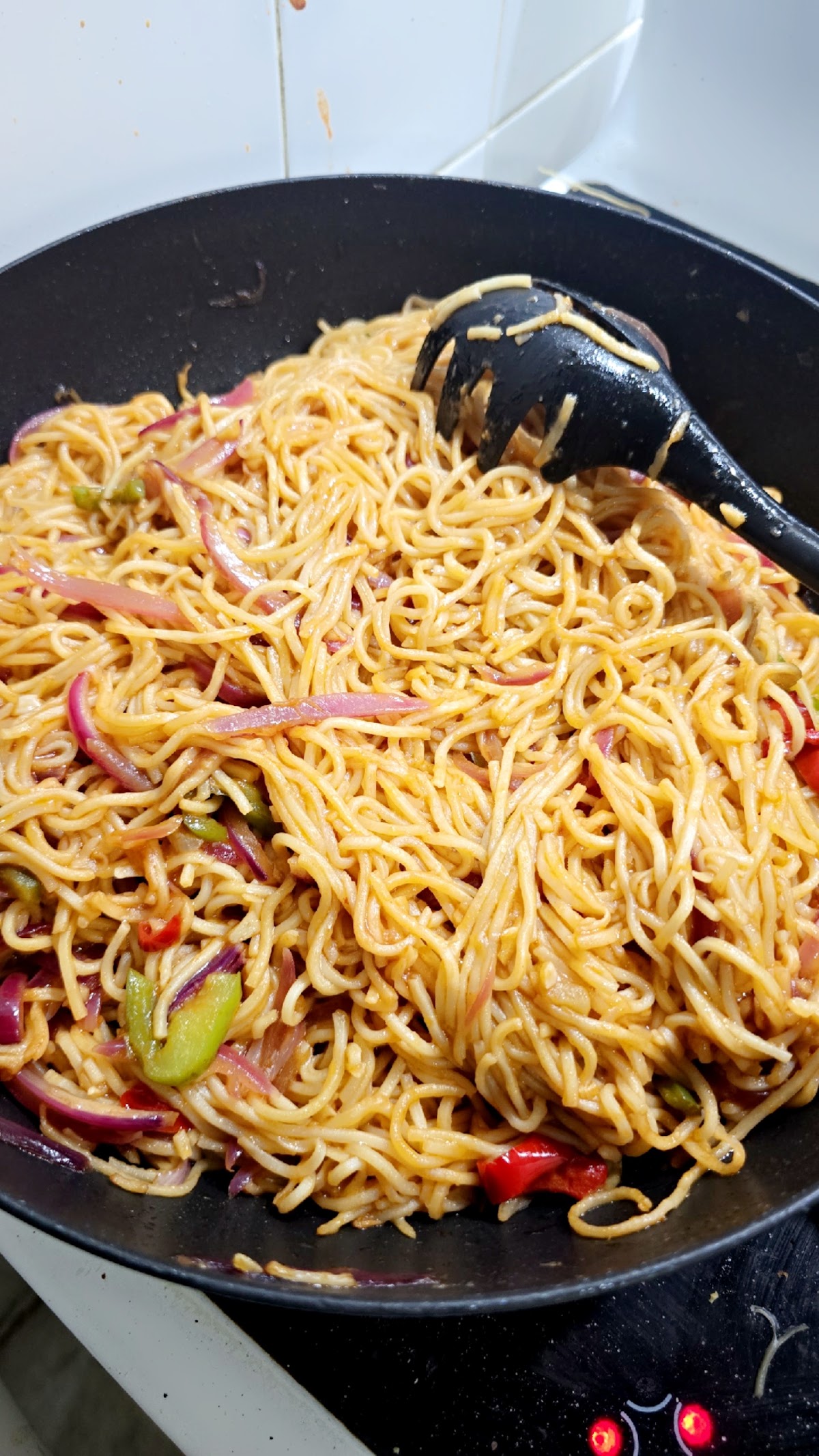 Veg noodles tossed in the wok